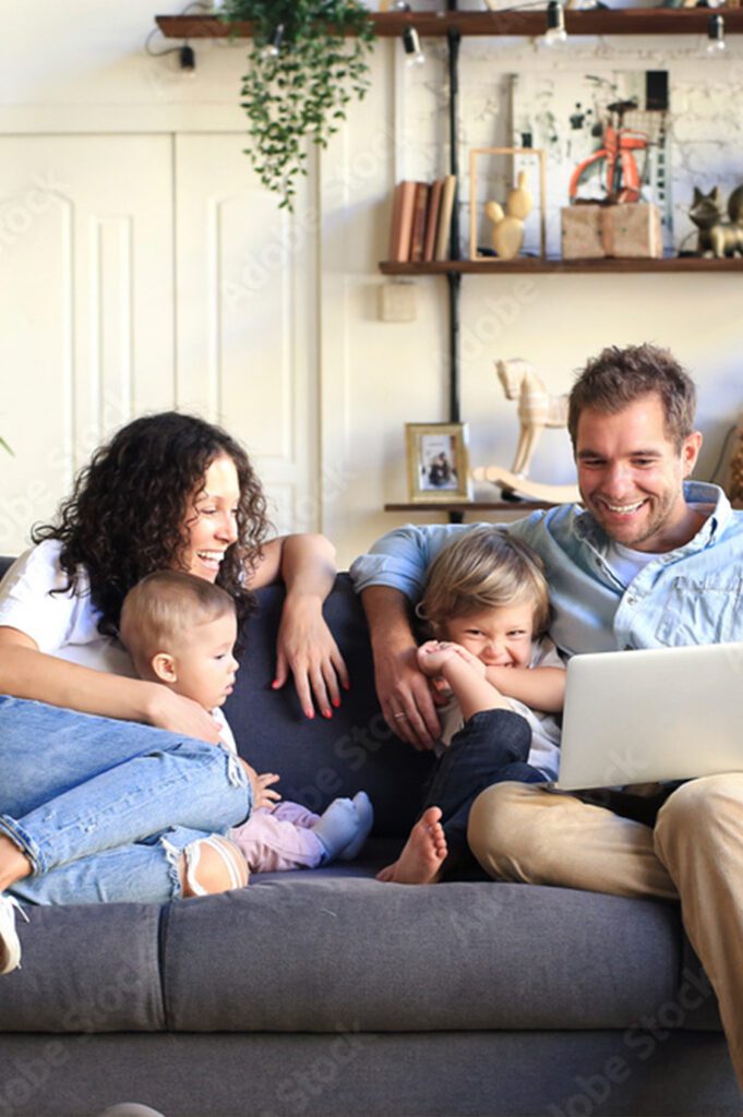 family on couch happy together